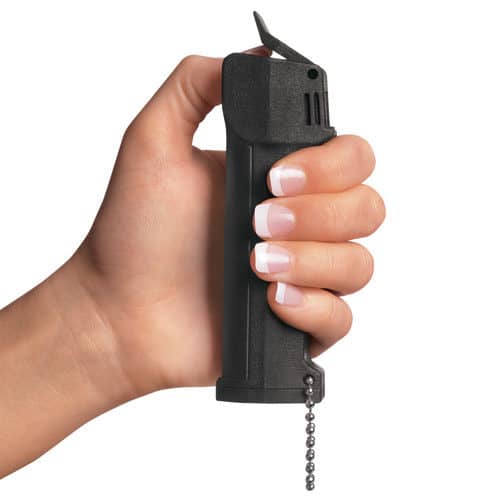 Mace® Triple Action Police Pepper Spray finger on trigger