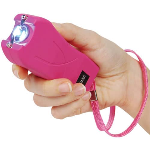 Runt Rechargeable Stun Gun With Flashlight And Wrist Strap Disable Pin in hand view - PINK