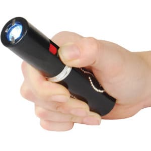 Stun Master Lipstick Stun Gun Rechargeable With Flashlight in hand action view - BLACK