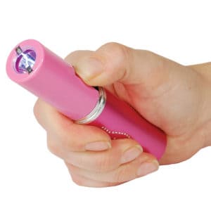 Stun Master Lipstick Stun Gun Rechargeable With Flashlight in hand action view - PINK